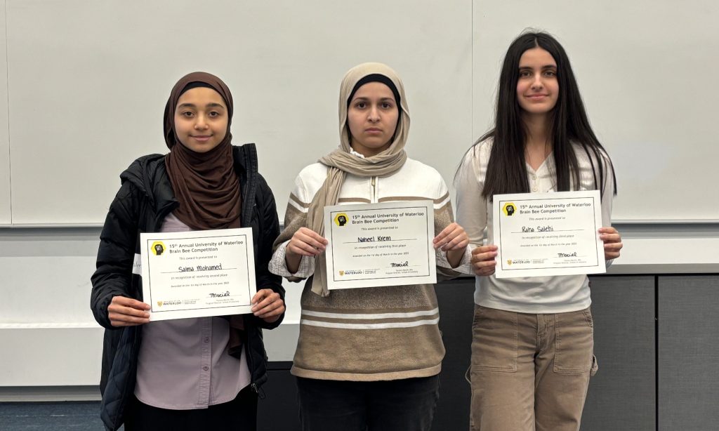 Winners of Brain Bee 2025 hold up their cheques.